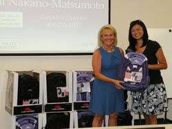 Cupertino/Sunnyvale District Chair Mary Combes (left) and Michelle Ma are pictured here with 48 backpacks donated to West Valley Community Services to be distributed to low-income students at the beginning of the school year.