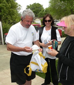 SILVAR President David Tonna﻿ and Diane Chandler﻿ hand a senior homeowner a complimentary RSVP (REALTOR® Service Volunteer Program) bag, which includes batteries, face mask to protect them from harsh chemicals, and a vial of life, so they can have their complete medical information ready in their home for emergency personnel to reference during an emergency.