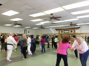 Real estate professionals practice some self-defense moves.